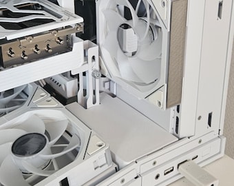 May include: A white computer case interior with multiple cooling fans and components. The case has a clean, modern design with a focus on airflow and efficient cooling. A USB drive is plugged into the front panel.