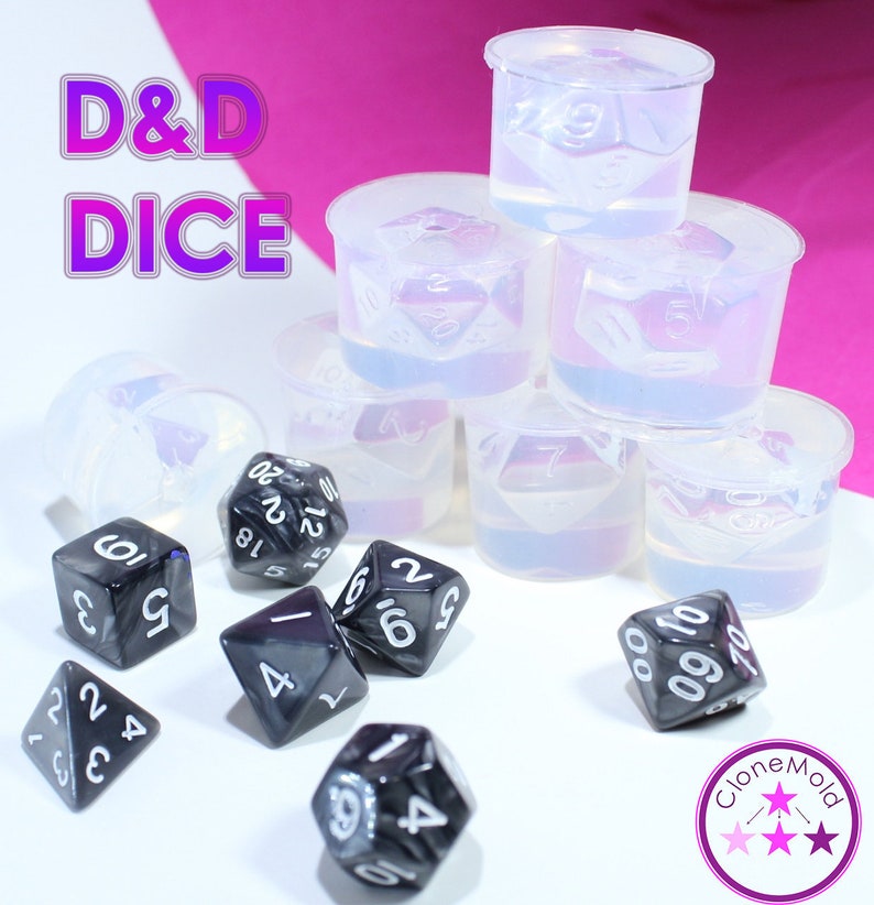 May include: A set of clear plastic molds for making D&D dice, with a set of black and silver dice in the foreground. The molds are stacked on top of each other, and the dice are scattered around the molds. The text "D&D DICE" is visible in the background.