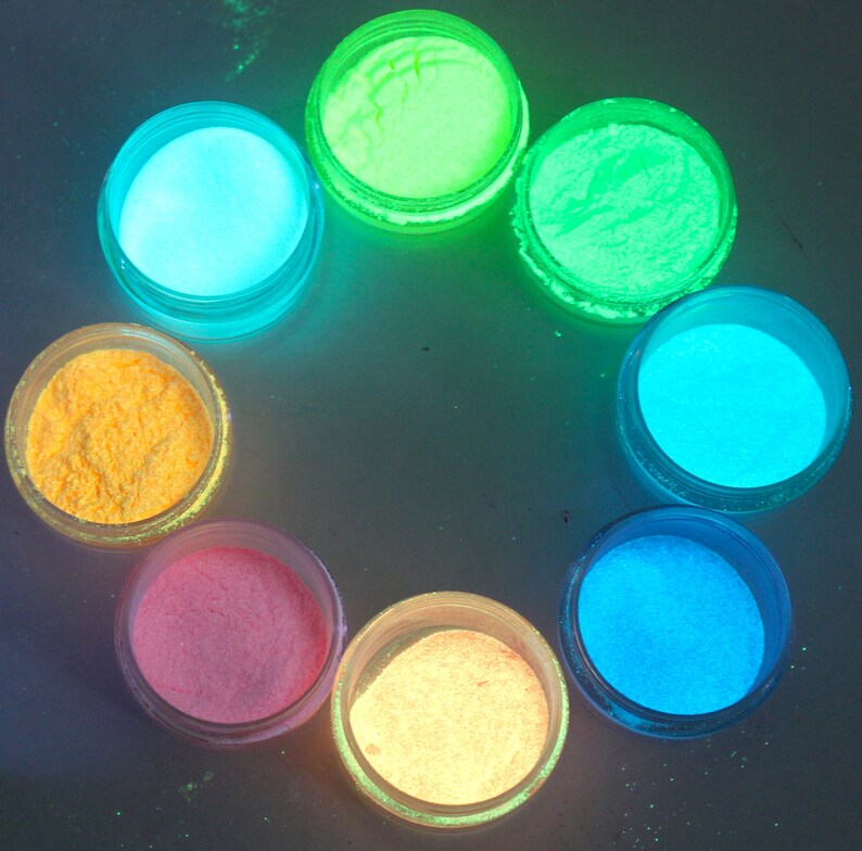 May include: Eight small jars of glow-in-the-dark powder in various colors, including yellow, orange, pink, blue, and green.