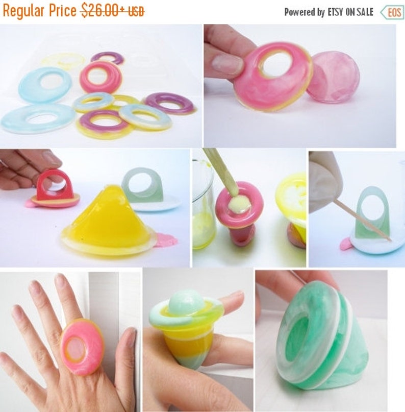 K&ouml;nnte beinhalten: Ein Set aus bunten Harzringen mit verschiedenen Designs, darunter ein Ring mit einer Kuppelform und ein Ring mit einer flachen Oberseite. Die Ringe sind aus klarem Harz gefertigt und haben verschiedene Farben, darunter Pink, Gelb, Blau und Gr&uuml;n. Die Ringe werden auf einem wei&szlig;en Hintergrund gezeigt.