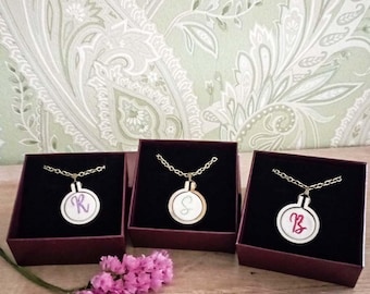 Personalized necklaces with embroidered initials, small frames with mini embroidery, jewelry gift ideas