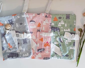 Set of napkin holders and diaper holders with matching pacifier holders that can be personalised with an embroidered name