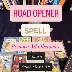 May include: An assortment of tarot card decks, including "Road Opener Spell" and "Remove All Obstacles" text. The decks are in various colors and designs, with titles like "Goddess" and "Reflective Tarot".