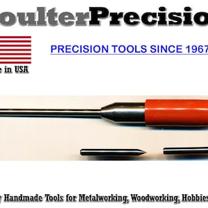 May include: A close-up of a metal tool with a red handle. The tool is labeled "Coulter Precision" and "Made in USA". The text "PRECISION TOOLS SINCE 1967" is also visible. The tool is used for metalworking, woodworking, hobbies, and art.