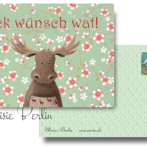 Puede incluir: Un juego de dos postales. La postal frontal presenta un alce de dibujos animados con cornamenta, un delantal estampado y el texto "Iek wünsch wat!" sobre un fondo floral verde. La postal trasera tiene una imagen pequeña y un diseño verde.