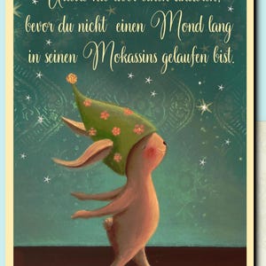 May include: A whimsical illustration of a bunny wearing a green hat with flowers, standing on a teal background with white stars. The quote "Urteile nie &uuml;ber einen anderen. bevor du nicht einen Mond lang in seinen Mokassins gelaufen bist." is written in cursive script.