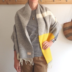 Grey scarf with cream stripe and large bright yellow stripe with cream tassles.   Personalised with a small leather patch and silver initials