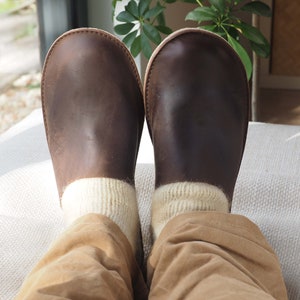 leather slippers being worn