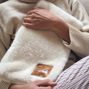Handmade sheepskin hot water bottle cover personalised with your message, winter gift, shearling cosy, mother's day gift