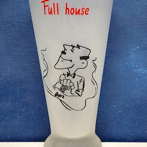 May include: A frosted glass with a cartoon illustration of a man holding a hand of cards. The glass has the words "Full house" written in red on the front.