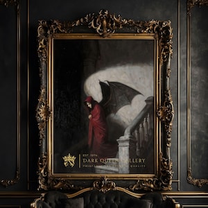 May include: A painting in a gold ornate frame depicts a figure in a red hooded cloak with large black wings standing on a staircase. The painting is titled "Dark Queen Gallery" with the text "Est. 1974" and "Print Quality".