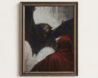 May include: A framed wall art print depicting a large, dark bat with bared fangs and spread wings confronting a figure wearing a deep red hooded cloak. The scene is set against a textured, light-colored background, enclosed in a dark, weathered frame.