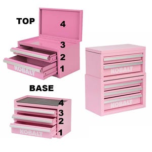 May include: Pink metal tool chest with four drawers and a top compartment. The word "KOBALT" is printed on the drawers. The top chest is open, revealing the interior. The base chest has a black top.