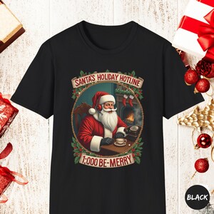 Santa&#39;s Holiday Hotline T-Shirt - Funny Vintage Christmas Shirt - Festive Santa Claus Graphic Tee - Holiday Gift for Her, Xmas Party Shirt
