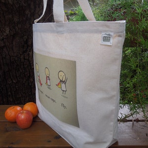 May include: White canvas tote bag with a red, yellow and blue illustration of three stick figures wearing capes. The text "wear cape... wear tape... fly." is printed on the bag.
