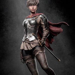 May include: A female figure in silver armour with a red cape, holding a sword. She is wearing brown leather boots and a brown leather belt. The background is a dark grey.