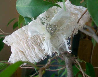 Wedding garter  Brides garter  Luxurious ruffles   Ivory lace  Bridal lingerie  Sheer white ribbon and  Rhinestone heart garnish