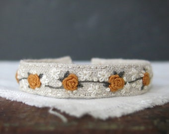 Embroidered Cuff Bracelet with Mustard Yellow and Cream Floral Vine on Natural Linen, Handmade Textile Art Jewelry, Adjustable Bracelet