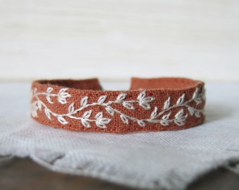 Hand Embroidered Cuff Bracelet, Cream Floral Embroidery on Burnt Orange Linen, Botanical Fabric Cuff Bracelet