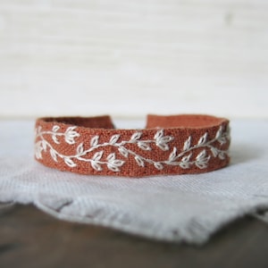 Hand Embroidered Cuff Bracelet, Cream Floral Embroidery on Burnt Orange Linen, Botanical Fabric Cuff Bracelet