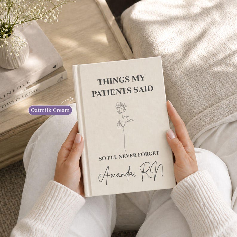 Oatmilk cream personalized nurse journal held in hands, featuring Things My Patients Said cover design with rose line art and custom name Amanda RN, styled as an elegant nurse appreciation gift.
