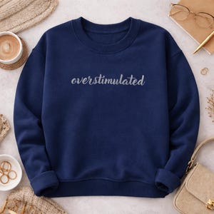Embroidered ADHD Sweatshirt Neurodiversity Crewneck Pullover Comfort Wear Soft Material Tubular Knit Design No Side Seams Clean Durable Embroidery Mental Health Expression Everyday Casual Style Supportive Messaging Unisex Fit Cozy Warmth