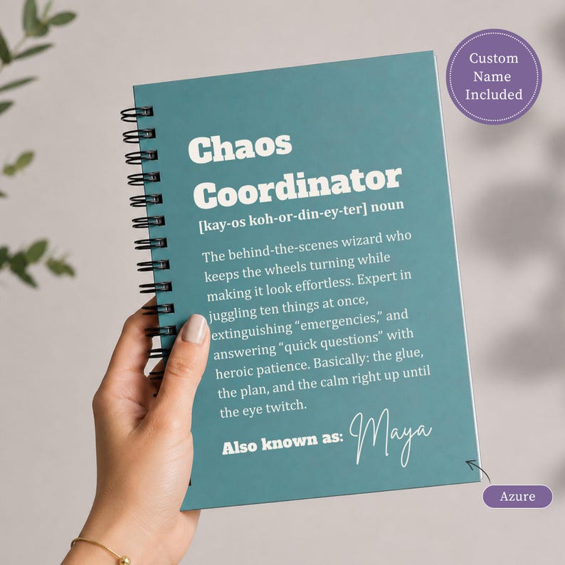 May include: A teal spiral-bound notebook featuring white text that defines Chaos Coordinator as a noun with a phonetic pronunciation and a humorous description. The cover includes the text Also known as: Maya and a circular badge stating Custom Name Included.