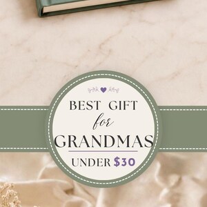 May include: A sage green hardcover journal titled Things My Grandchild Says, featuring the subtitle Funny Quotes & Sweet Memories, the phrase So I'll Never Forget, and a personalized name in white script text on the front cover.