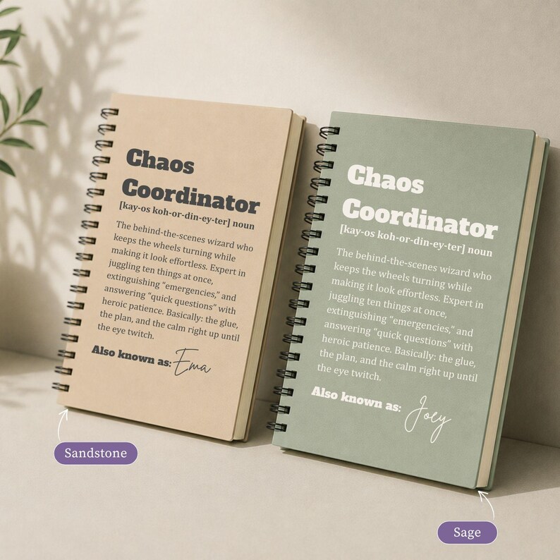 May include: Two spiral-bound notebooks with sandstone and sage covers. Each features the text Chaos Coordinator, a phonetic pronunciation, a definition of the term, and the phrase Also known as followed by a handwritten name, Ema or Joey.