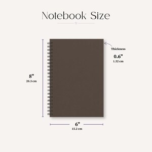 May include: A dark brown spiral-bound notebook with dimensions labelled as 20.3 cm by 15.2 cm and a thickness of 1.52 cm. The text 'Notebook Size' appears at the top, with measurement lines indicating the height, width, and thickness.