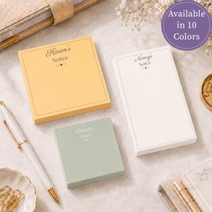 May include: Three personalized note pads in yellow, white, and sage green. The yellow pad reads Karen's Notes, the white pad reads Nancy's Notes, and the sage green pad reads Donna's Notes. Each pad features a thin border and a small heart icon.
