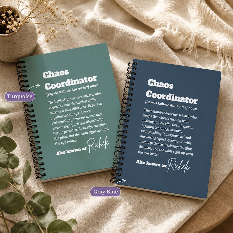 May include: Two spiral-bound notebooks with black wire binding. The left notebook is turquoise and the right is gray-blue. Both feature the white text Chaos Coordinator, a dictionary-style definition, and the custom name Richele in script.