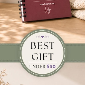 May include: A spiral-bound notebook with a dark red cover featuring the white text Chaos Coordinator, a dictionary-style definition, and a space for a name. A gift box contains three additional notebooks in dark red, tan, and light purple colors.