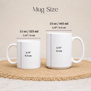 May include: Two white ceramic mugs labeled Mug Size. The smaller mug is 11 oz / 325 ml, 3.15 inches wide, and 3.74 inches tall. The larger mug is 15 oz / 443 ml, 3.39 inches wide, and 4.72 inches tall, with clear measurement lines provided.