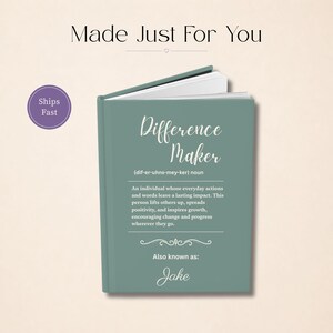 May include: A teal-colored journal titled "Difference Maker" with the definition of the term. The text includes "Also known as: Jake". The cover has a soft, matte finish. The words "Made Just For You" are at the top.