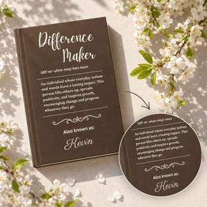 May include: A brown book with the words "Difference Maker" in white script. The text defines the term and includes the name "Kevin". White flowers and green leaves are in the background.