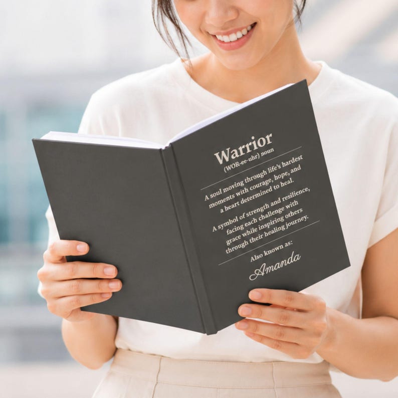 Charcoal personalized healing journal featuring a Warrior definition cover, custom name, and inspirational recovery message. Thoughtful cancer survivor gift, recovery notebook, encouragement journal, patient support keepsake, or treatment journal for someone facing a hard season with courage, hope, strength, and resilience.