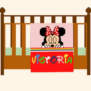 May include: A white ceramic mug with a black handle and the text "But First, Coffee" in a bold, black font. The mug is set against a blurred background, suggesting a cozy setting.