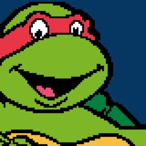 May include: A pixel art illustration of a green turtle character with a red eye mask. The turtle has a wide, smiling mouth, large white eyes with black pupils, and a light green face. The background is a solid dark blue color, creating a contrast.