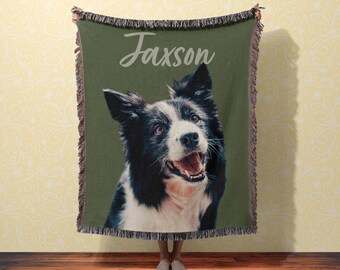 May include: A green woven throw blanket with a black and white border collie dog image and the name "Jaxson" printed in white.