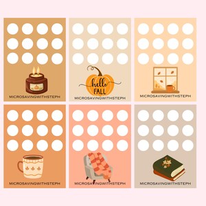 May include: A collection of six fall-themed illustrations on a light pink background. Each illustration features a different fall element, including a candle, pumpkin, window, mug, chair with a blanket, and a book. The text "hello FALL" is on one of the illustrations.