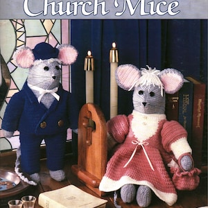 May include: A Leisure Arts leaflet 2147 titled Crocheted Church Mice featuring two crocheted mouse figures. One mouse wears a blue suit and hat, the other a pink and white dress. The cover includes text, candles, a Bible, and sheet music.