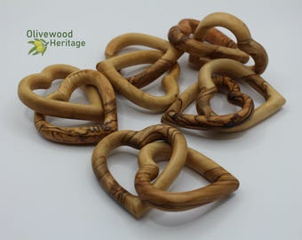 Two interlocked hearts handmade from authentic olive wood in Bethlehem