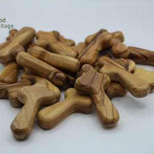 Small cross handmade from authentic olive wood in Bethlehem
