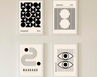 May include: Four framed Bauhaus art prints. Each print features a minimalist design in black and white. The prints include geometric shapes, lines, and the text "BAUHAUS" and the year "1919" or "July-Sept 1919".