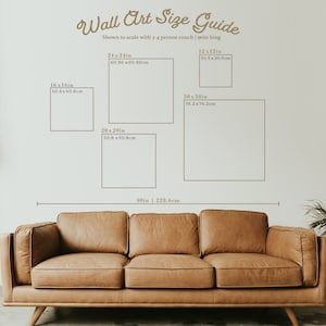 May include: A guide to wall art sizes, shown to scale with a 90-inch long couch. The guide includes various sizes of square and rectangular wall art, with measurements in inches and centimeters.