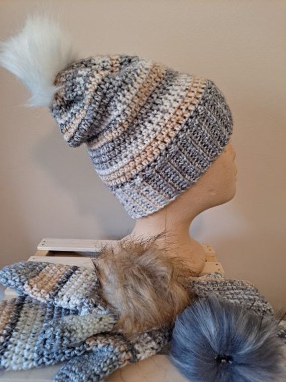 hat with interchangeable pom pom