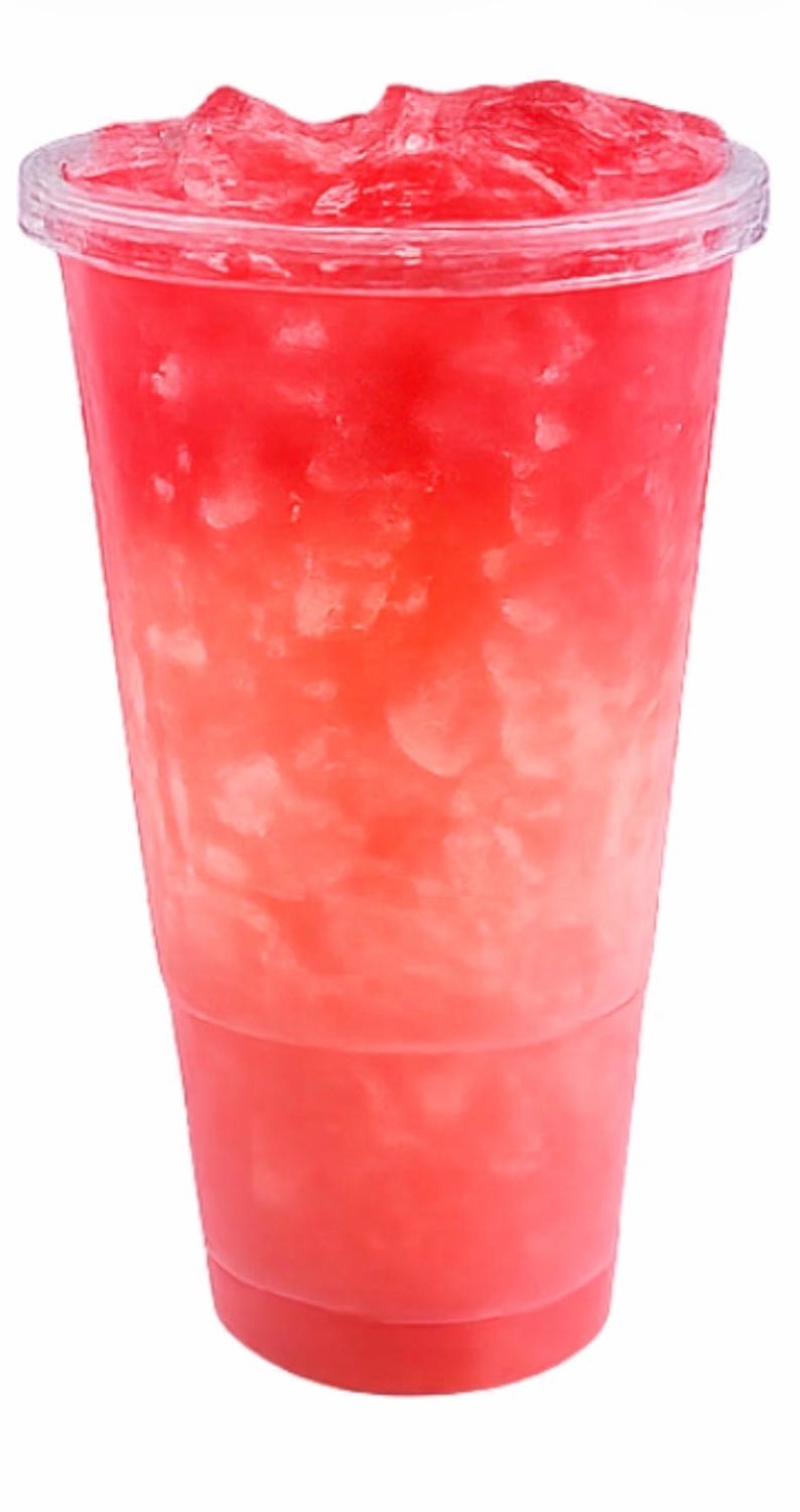 May include: A clear plastic disposable cup filled with a vibrant red liquid and a large amount of crushed ice. The cup features a transparent lid and a tapered design, showcasing the bright red beverage and the texture of the ice inside.