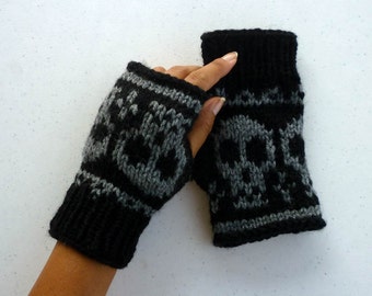 May include: Black and gray fingerless gloves with a skull pattern.