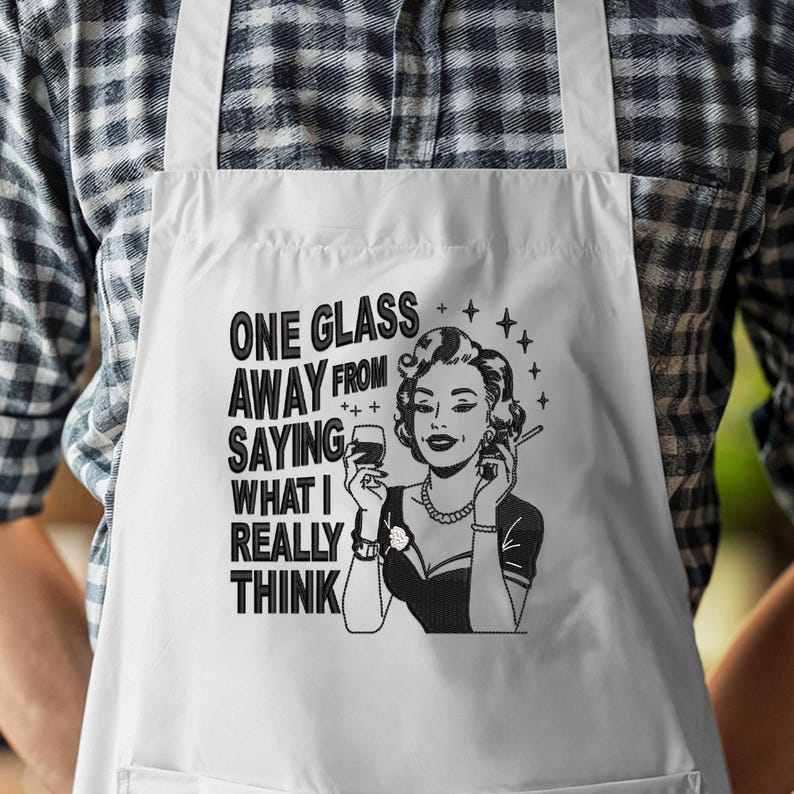 May include: White apron with the text "ONE GLASS AWAY FROM SAYING WHAT I REALLY THINK" and a black and white illustration of a woman holding a glass of wine and a cigarette.